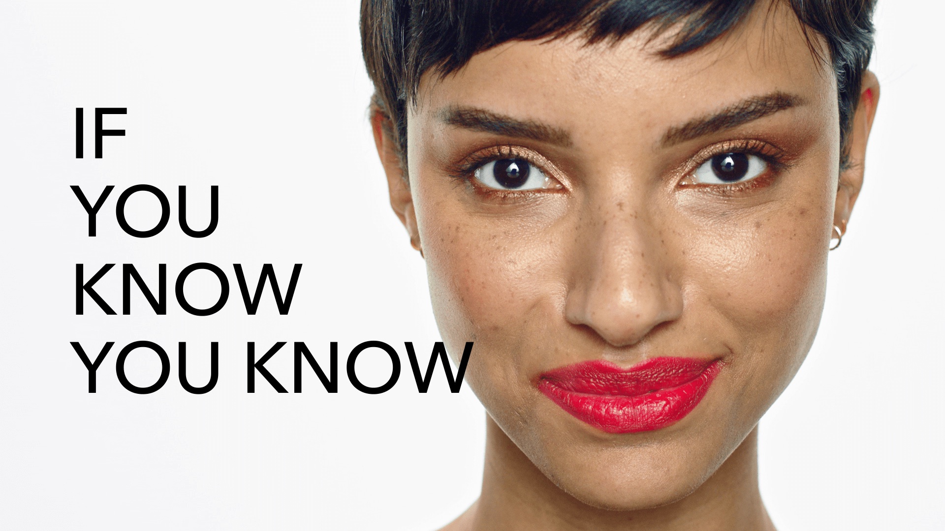 Still from the Douglas Collection commercial – beauty close-up of a woman with red lipstick beside the claim IF YOU KNOW YOU KNOW 